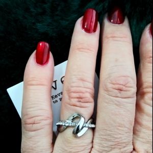 Silver Covet swirl ring Rhinestones. Sz 7. NWT